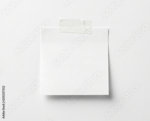 Single Blank White Sticky Note with Tape on Isolated White Background