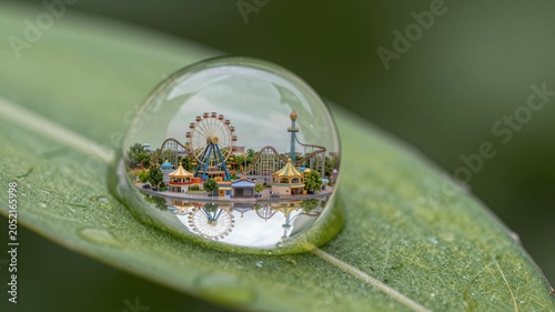 Miniature Amusement Park Reflected In Single Raindrop
