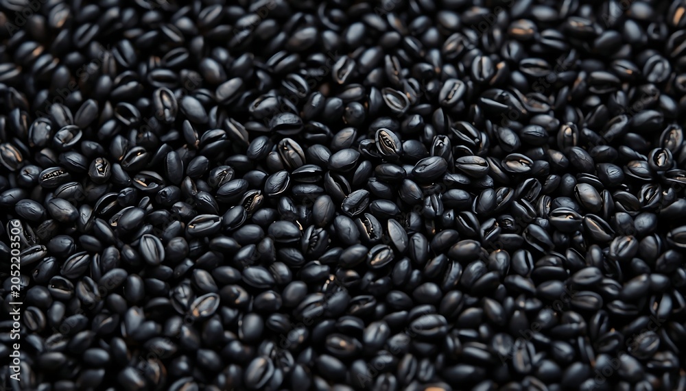 Obraz premium Closeup of dark roasted coffee beans texture background