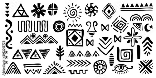 Photos Hand drawing ethnic tribal symbols creating abstract geometric patterns for folk