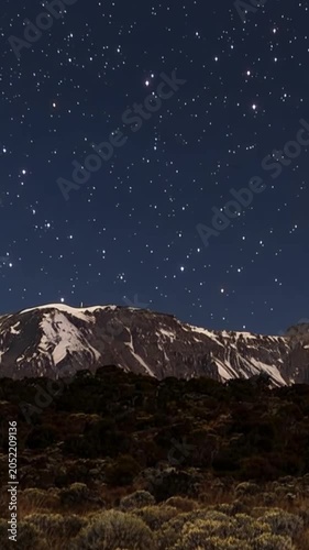 Mount Kilimanjaro. Kilimanjaro National Park in Tanzania, Africa. Trekking and climbing to the summit. Time lapse in vertical video