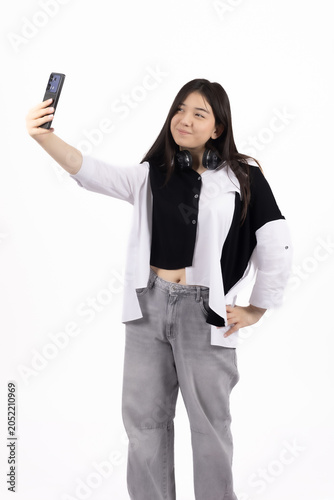Young modern woman holding digital mobile electronic tech gadget device