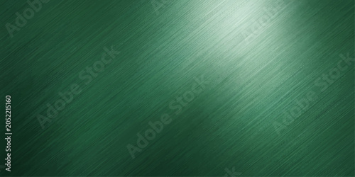 Fotografía Textured brushed metal surface in a deep emerald green hue, with a soft light creating a subtle gradient and highlighting the fine parallel scratches