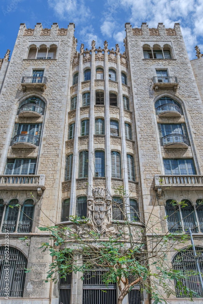 Fototapeta premium Old Caja de Pensiones Building Neo Gothic Facade, Barcelona, Historic Stone Architecture
