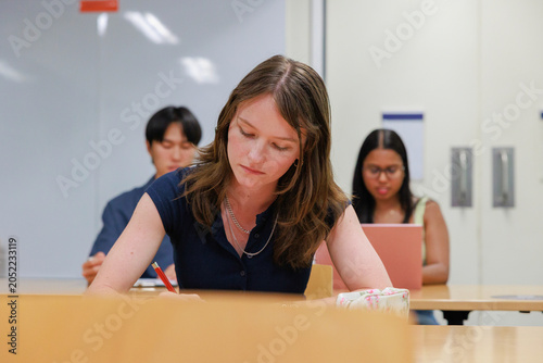 International University Students Studying in Campus Classroom