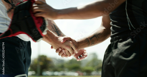 Foto People, sport and handshake with team for match, good game or thank you on outdoor pitch