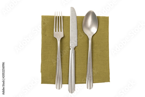Top view of green napkin, fork, knife and spoon isolated no background cutout