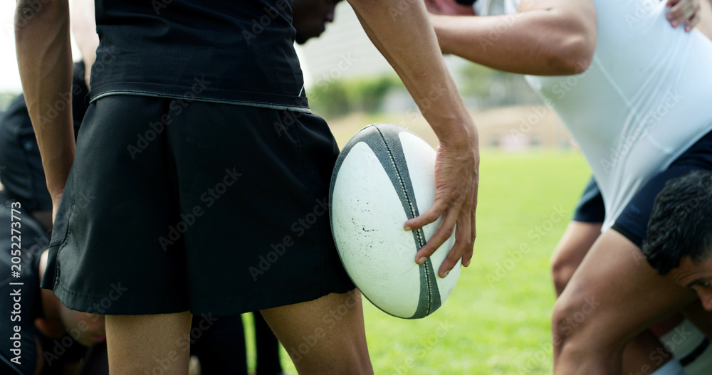 Naklejka premium Rugby, training and hands of man with ball on field for tournament match, cardio and competition. Sports, athlete and player with exercise, workout and fitness for practice, performance or contest