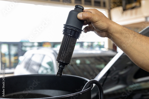 Auto mechanic working in repair shop garage. Vehicle maintenance and inspection service