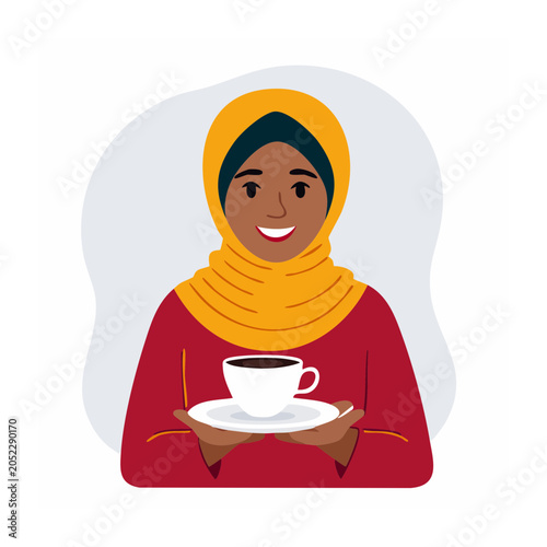 Woman in hijab holding a cup of coffee