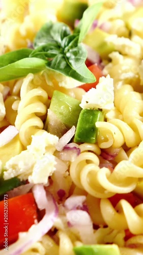 cold pasta salad with fusilli feta cheese tomatoes and basil