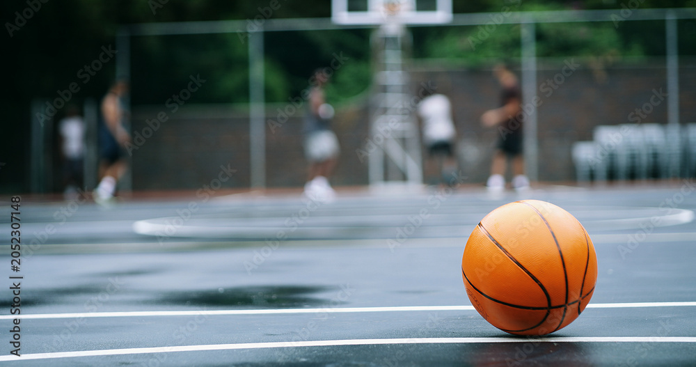 Naklejka premium Basketball ball, sports and court for outdoor competition, fitness and play on college campus. Hobby, asphalt and game playground space for match, morning and practice ground at athletic club