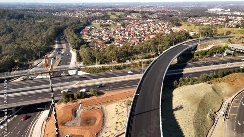 Aerial drone view above the M7 -M12 Interchange at Cecil Hills, Western Sydney, NSW Australia on a sunny morning in June 2026