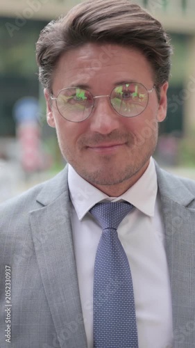 Middle Aged Businessman Pointing at the Camera and Inviting, vertical video