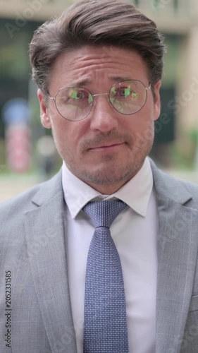 Middle Aged Businessman Shaking Head as No Sign, vertical video