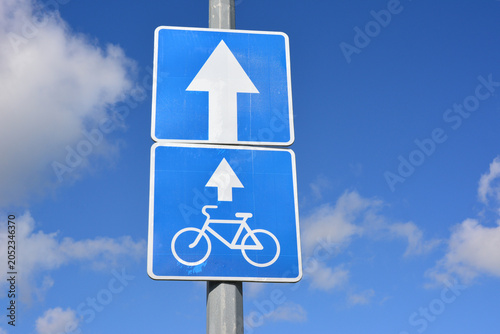 Blue Road Sign with Up Arrow and Bicycle Symbol on the blue sky background