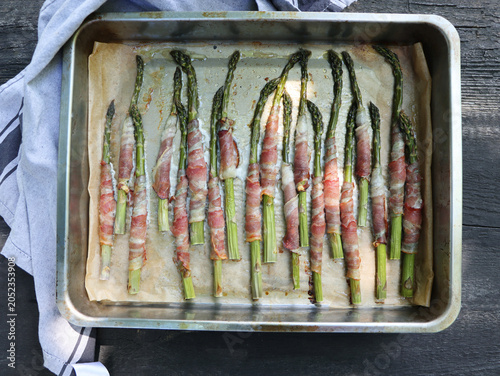 Roasted Asparagus Wrapped in Prosciutto on Baking Sheet