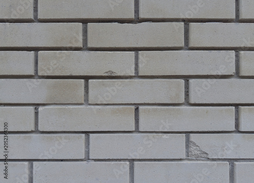 Foto Brick wall texture featuring light grey silicate blocks laid out in a clean seam