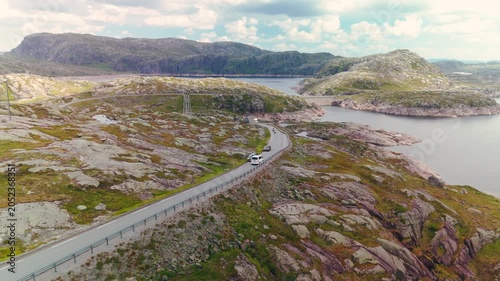 Aerial Drone Footage of White Camper Van Driving Through Norwegian Highlands