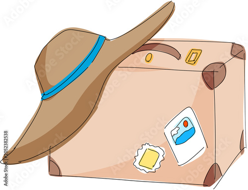 Straw hat and traveling suitcase