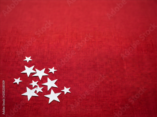 White stars scattered on red textured background fourth of july america theme