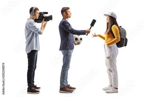 Sport tv reporter interviewing a female student