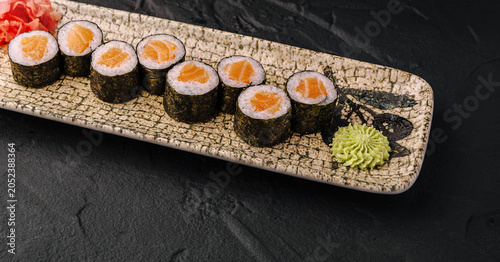 Obraz na płótnie Salmon Maki Sushi Rolls on Stone Plate