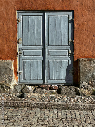 Old Timeworn Wooden Door of Entrance to House on Medieval Street of Porvoo (Borgå) in Finland. Architectural Detail.