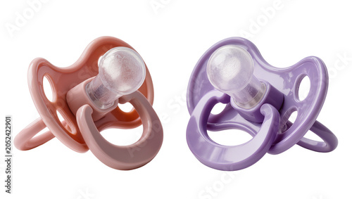 Schilderij op canvas Two baby pacifiers pink and purple, with clear nipples