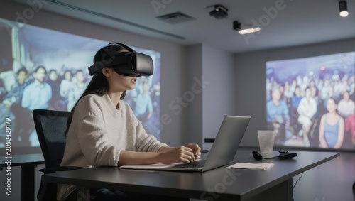 Woman using VR headset and laptop in immersive meeting room.