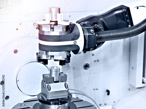 Industrial Robotic Gripper Handling Metal Component in CNC Cell