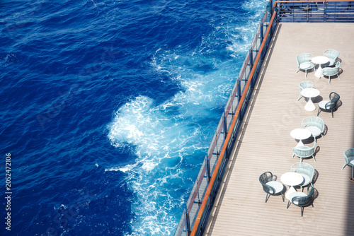 Quadro su tela Aerial view of cruise ship deck overlooking blue ocean