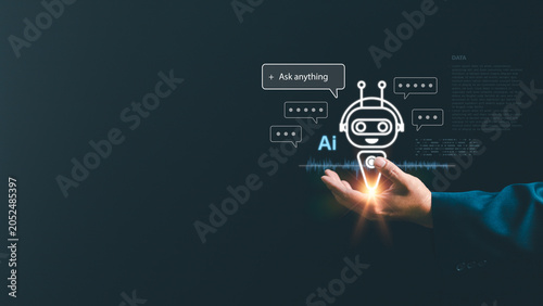 Businessman hand holding a glowing AI chatbot icon with virtual chat bubbles. Futuristic artificial intelligence, machine learning, and digital virtual assistant technology concept