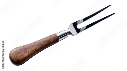 Fotografia Carving fork with polished metal tines and wooden handle