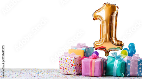 First birthday party celebration setup with colorful wrapped gifts and shiny number one foil balloon, isolated on white background