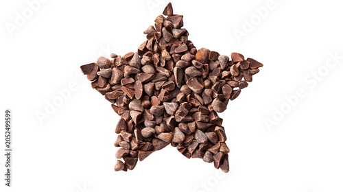 Star shape formed from raw cocoa nibs, healthy dark chocolate ingredient for baking and confectionery, isolated on white background