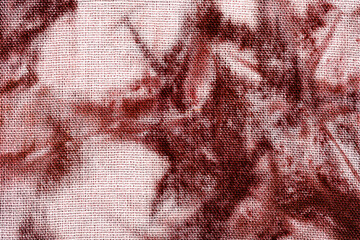 Close up of red and white tie dye fabric texture