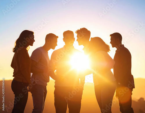 Silhouette group people sunset sunlight friendship together outdoor backlight teamwork Silhouette group of people sunset with bright sunlight, friendship and together outdoor backlight mood
