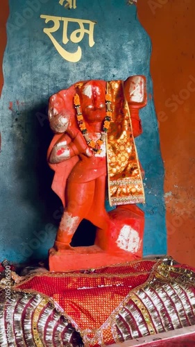 Religious statue of Lord Hanuman inside a temple shrine, captured in a devotional setting with detailed craftsmanship, spiritual significance, and cultural heritage of India.