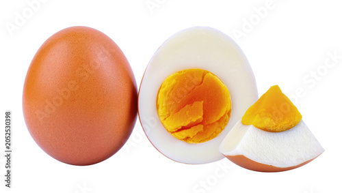 Obraz na plátně Whole and halved hard-boiled brown egg with bright yellow yolk