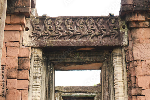Fotografie Amazing ancient stone lintel carving depicting traditional dancers on a lintel a