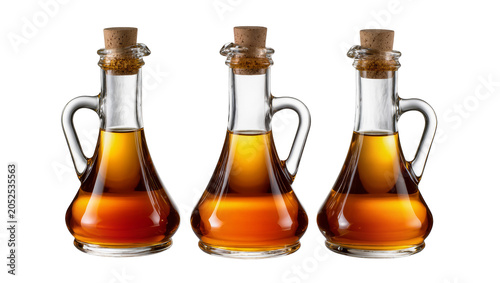Tableau sur toile Three glass cruets with cork stoppers filled with amber liquid
