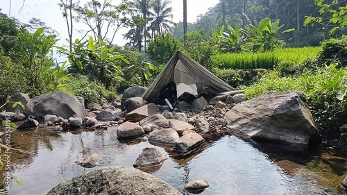 Camping by the Riverside in a Serene Natural Forest Landscape
