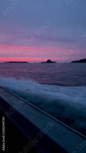 Boat Wake at Sunset with Pink and Purple Sky, Vertical Ocean Travel Background 02