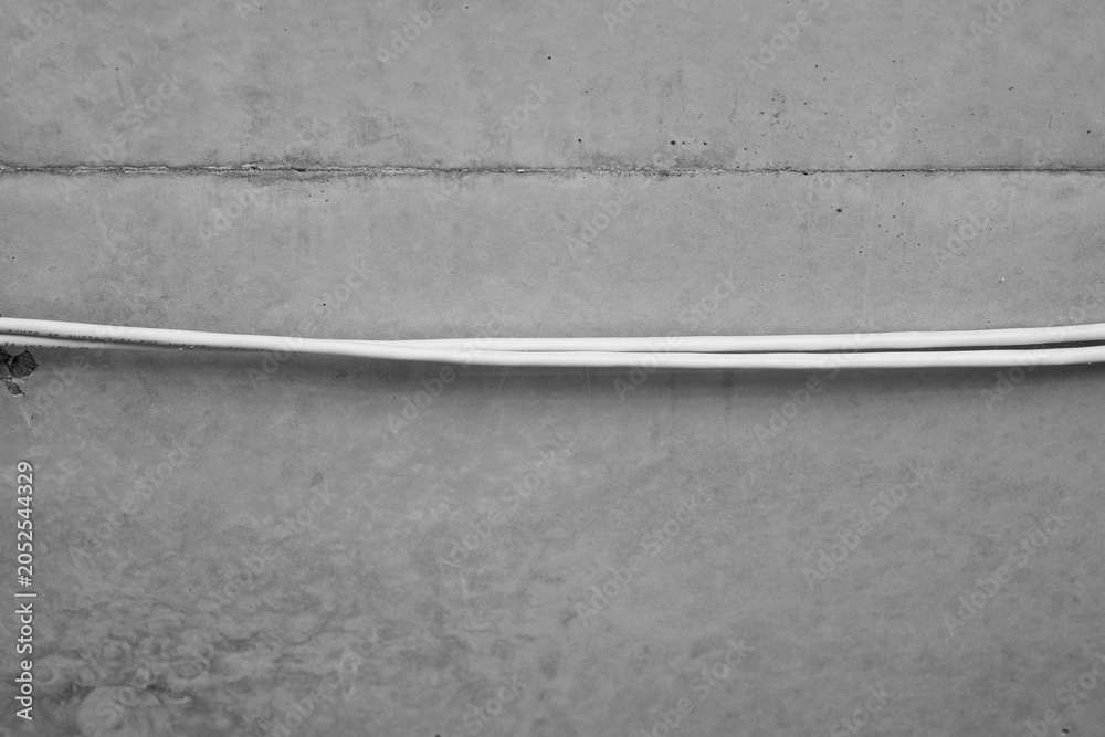 Fototapeta premium Two white lines on concrete texture
