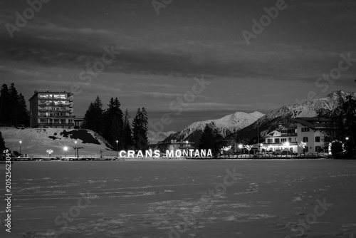 Scenic view of frozen and snow covered Etang Grenon (Lac Grenon) with illuminated lettering 