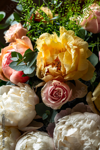 Macro shot of fresh bunch of peonies bouquet of different colors. Card Concept, gentle abstract floral background image, close up, shallow DoF