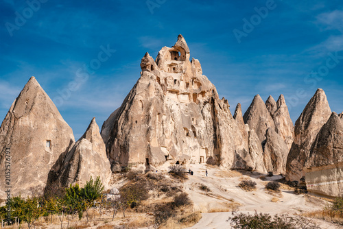 Tableau sur toile Cappadocia, Turkey - November 03 2025: Ancient rock-cut cave dwellings and fairy