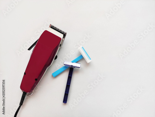 Electric trimmer and disposable razors for body grooming and hair removal. Modern shaving tools for personal care and hygiene.