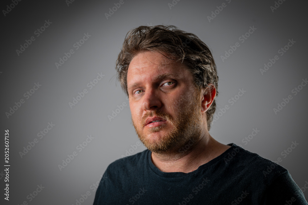 Fototapeta premium Man Looking Through Airborne Dust in Room